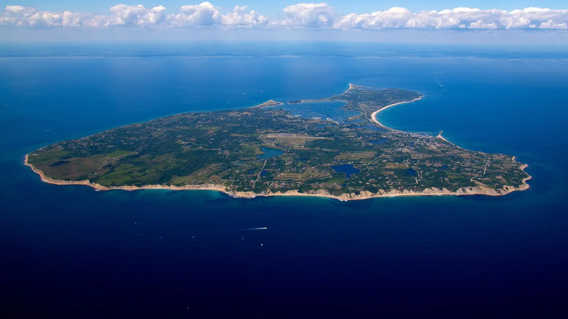 Block Island, Rhode Island aerial view from the south with Rhode Island coastline in the distance.