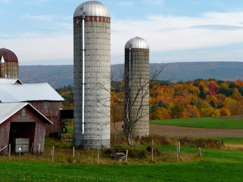 Grain silos on a dairy farm in Brunswick, New York, United States during autumn