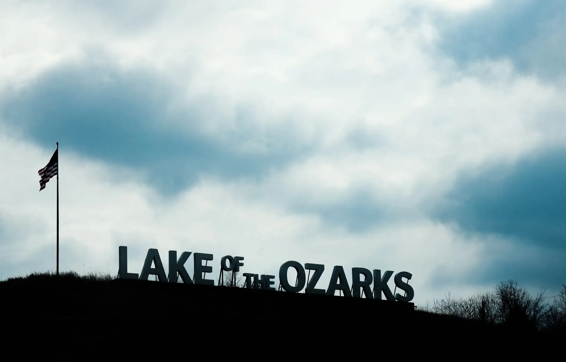Signage for Lake of the Ozarks, along US Route 54 near Lake Ozark, Missouri.