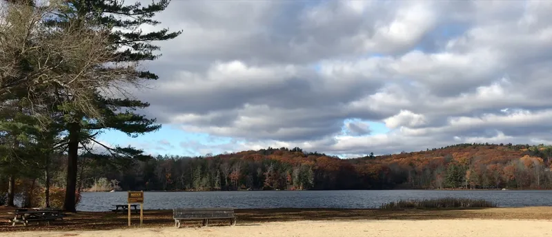 Paugnut State Forest's hills in autumn viewed from the north-east shore of Burr Pond.