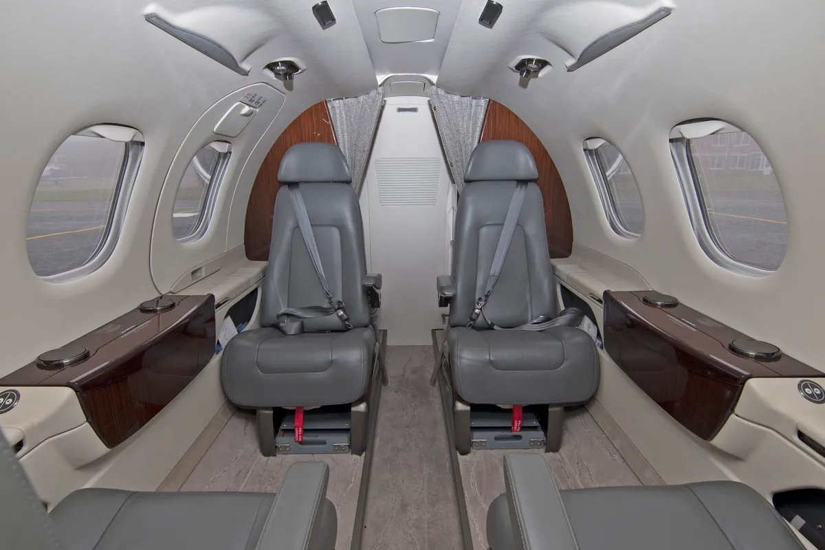 Four club seats inside the Phenom 100 cabin