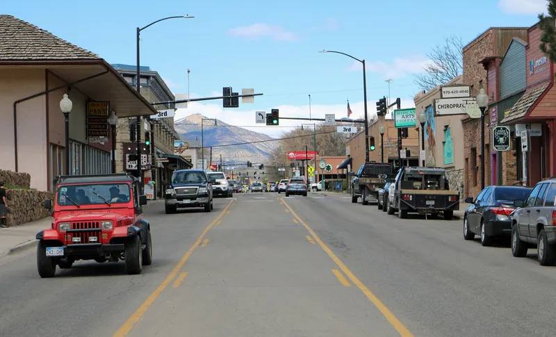A view of Railroad Avenue in Rifle, Colorado. The view is to the north, and part of the Grand Hogback is seen in the distance.