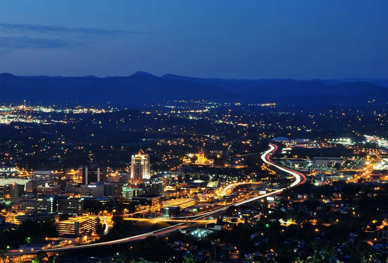 Roanoke City as seen from Mill Mountain Star at dusk in Virginia, USA.