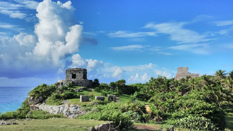 Tulum's Templo del Dios Viento (Temple of Wind God, left) and Castillo (castle, right)
