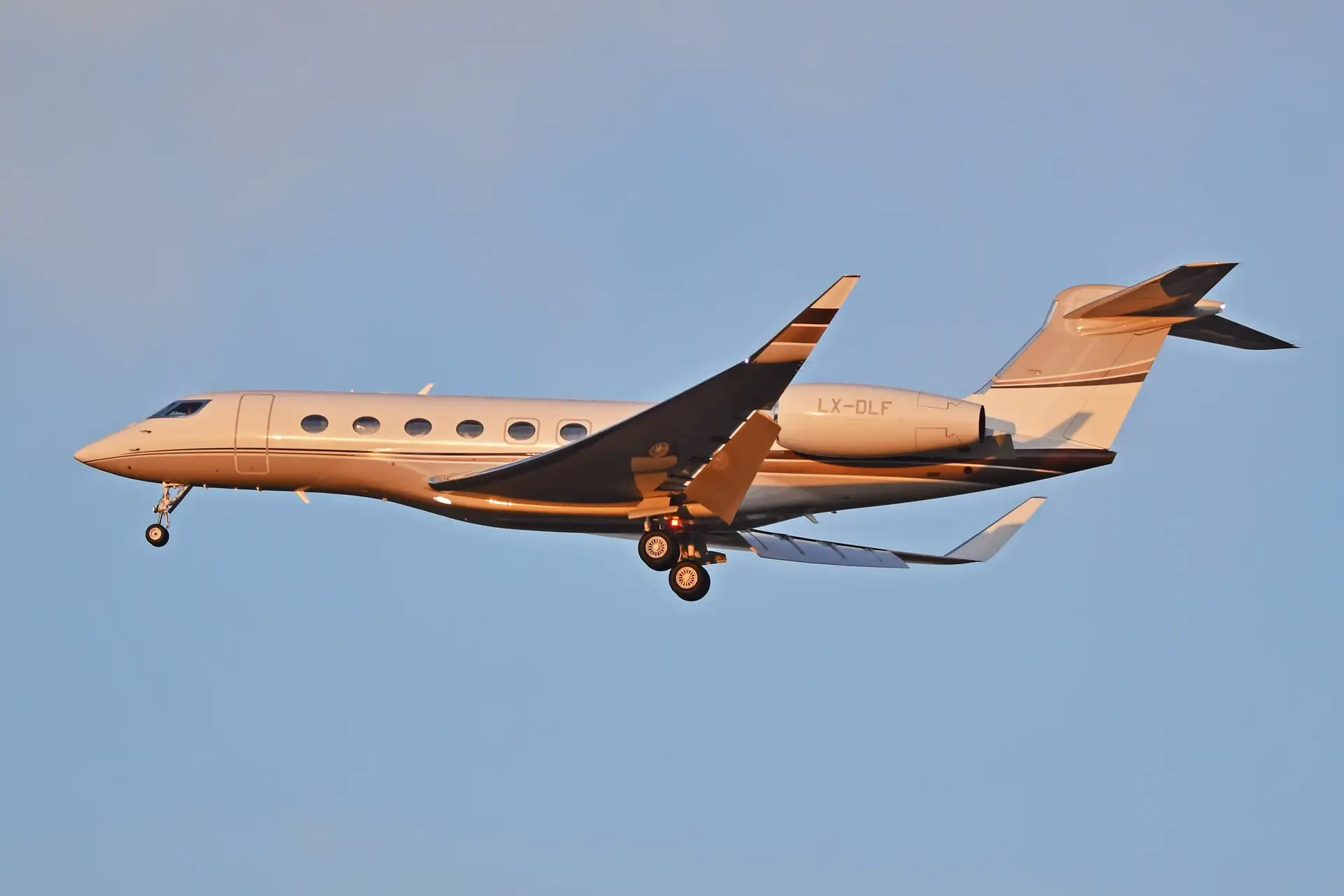Gulfstream G650 ultra-long-range jet on approach at sunset